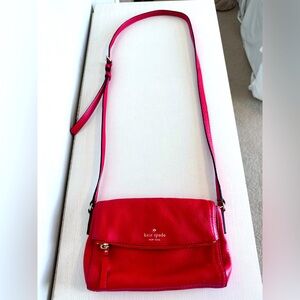 Kate Spade leather crossbody (red) with zipper and magnetic closure.
